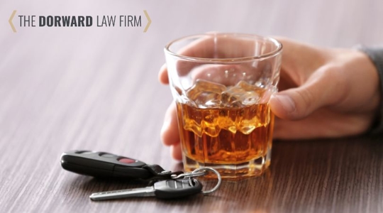 person with alcohol drink and car keys